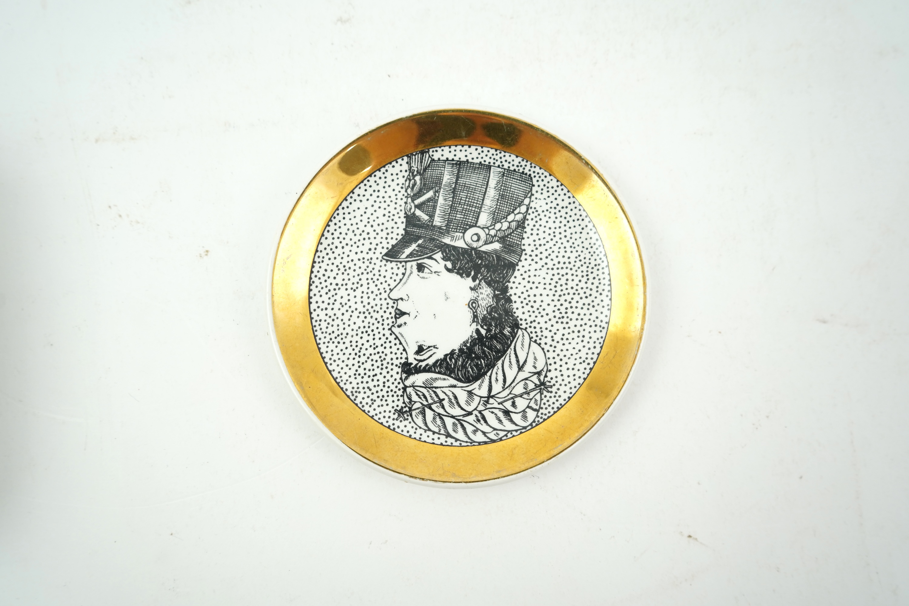 Piero Fornasetti (Italian, 1913-1988): A collection of Fornasetti desk items and dishes
